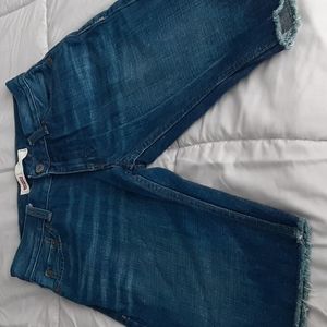 Boys cut off Levi jean shorts.